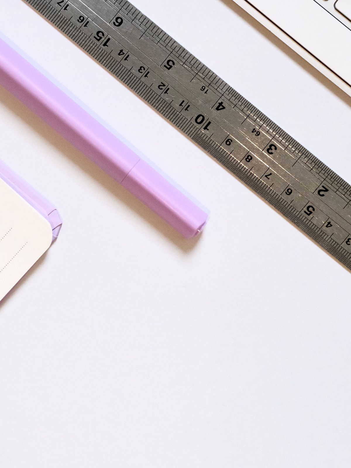 Stationery and notebook on a clean office desk