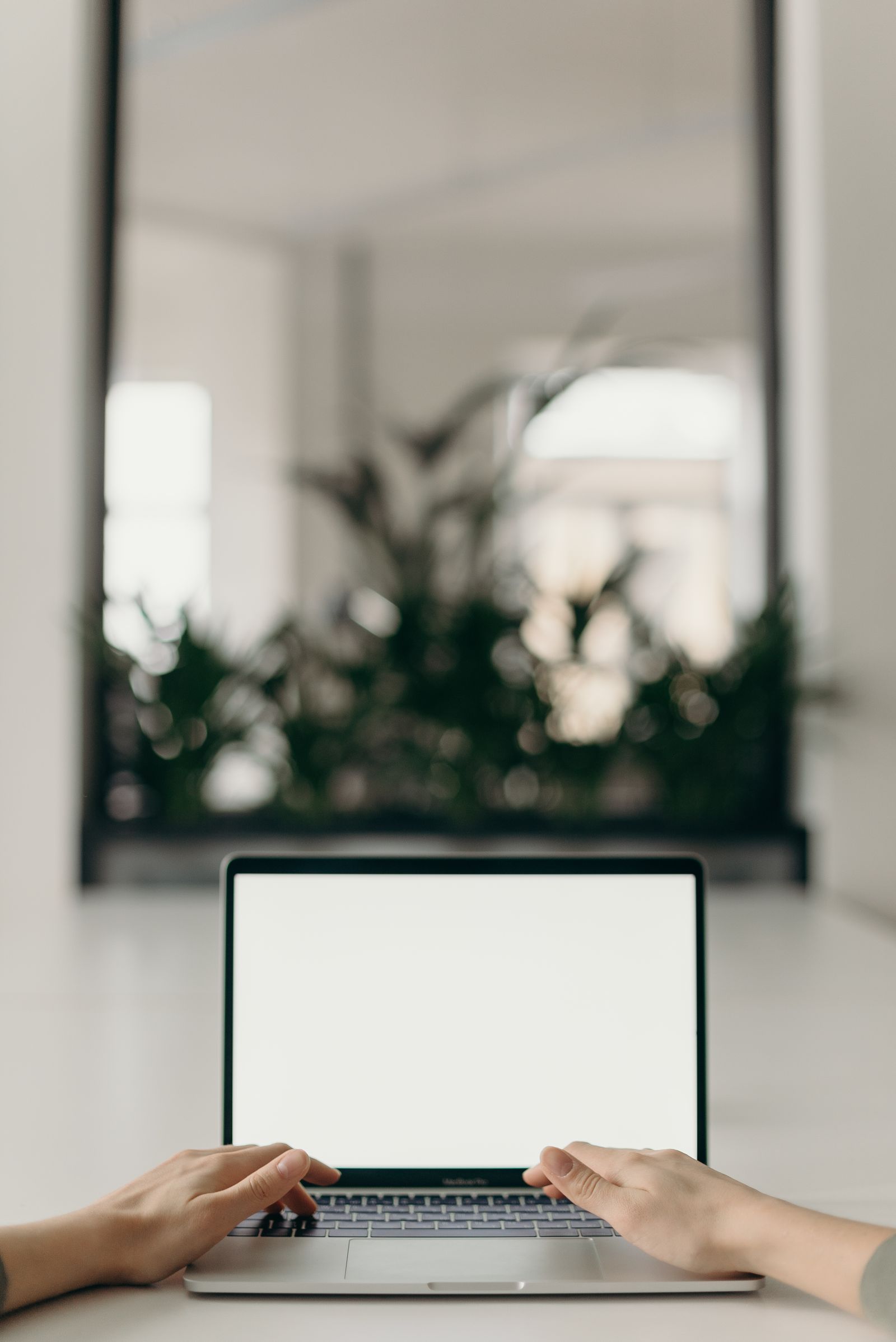 Laptop and smartphone on a modern desk